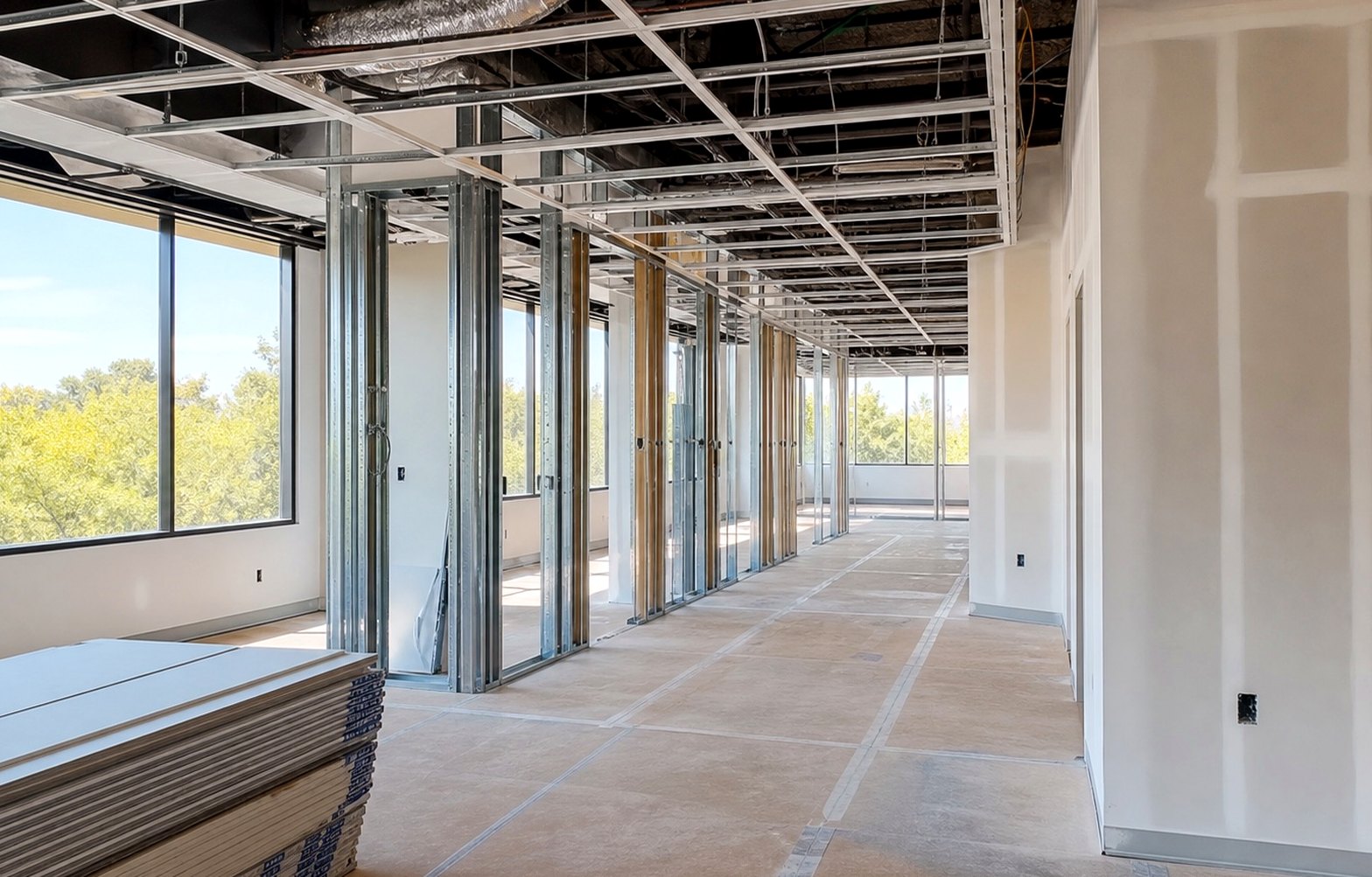 Commercial Tenant Improvements planning scene for San Jose remodeling planning: The finished suite keeps those exact rooms, columns, openings, work area, and circulation while completing the acoustic, lighting, glass, and finish plan.