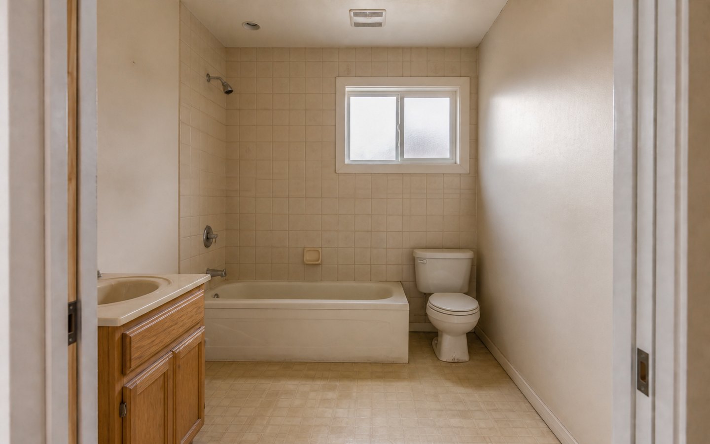 Bathroom Remodeling before planning visualization of the same space: A dated tub bathroom with a small vanity makes layout, storage, fixture, ventilation, and moisture-control needs easy to compare.