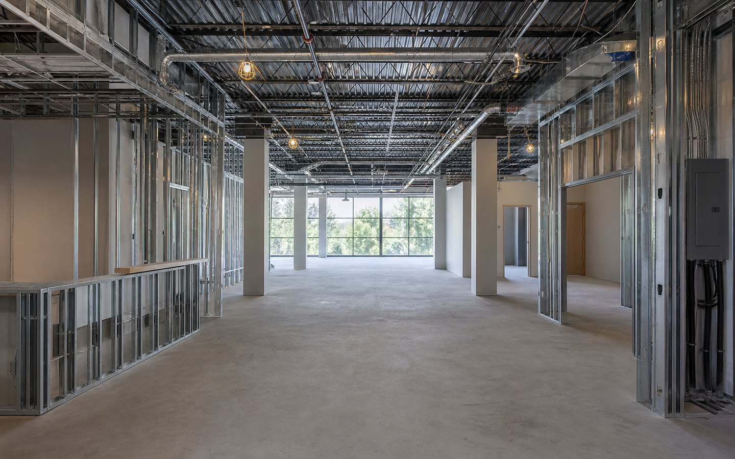 Commercial Tenant Improvements during planning visualization of the same space: Metal-stud reception, conference, work, and storage zones establish the exact build-out plan and coordinated rough systems.