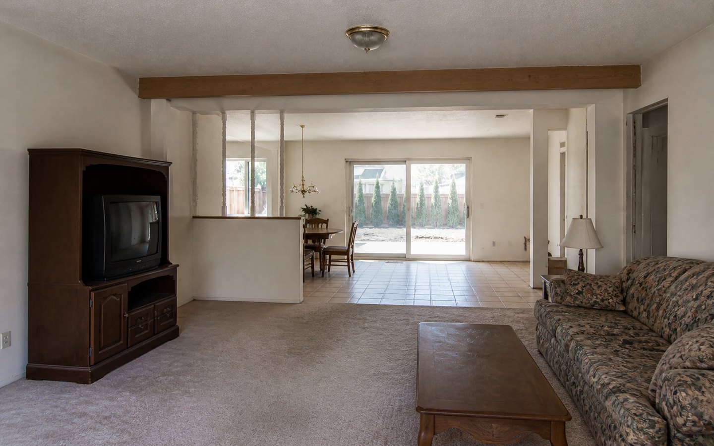 Home Remodeling before planning visualization of the same space: A dated divided living-and-dining plan reveals the circulation, opening, lighting, flooring, and finish-continuity decisions to organize.