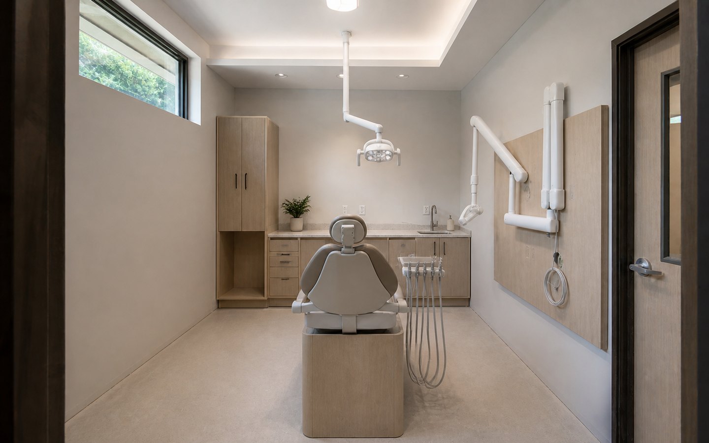 Medical and Dental Office Remodeling after planning visualization of the same space: The finished room keeps that exact chair, utility, casework, sink, storage, equipment, and task-light geometry while completing cleanable surfaces.