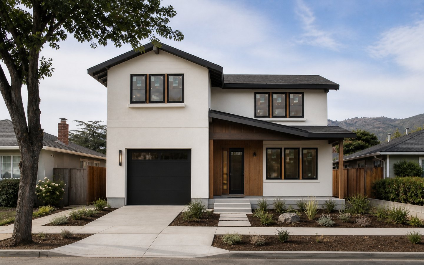 New Home Construction after planning visualization of the same space: The finished home keeps that exact massing, roof, garage, entry, and window geometry while completing the exterior materials and landscape.