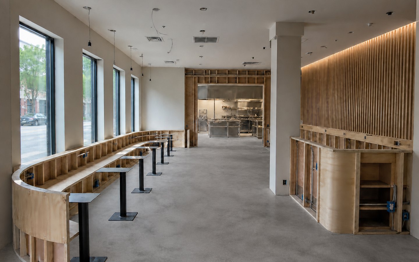 Restaurant Remodeling during planning visualization of the same space: The curved banquette, aligned tables, central aisle, host station, acoustic wall, and pendant rough-ins establish the redesigned dining layout.