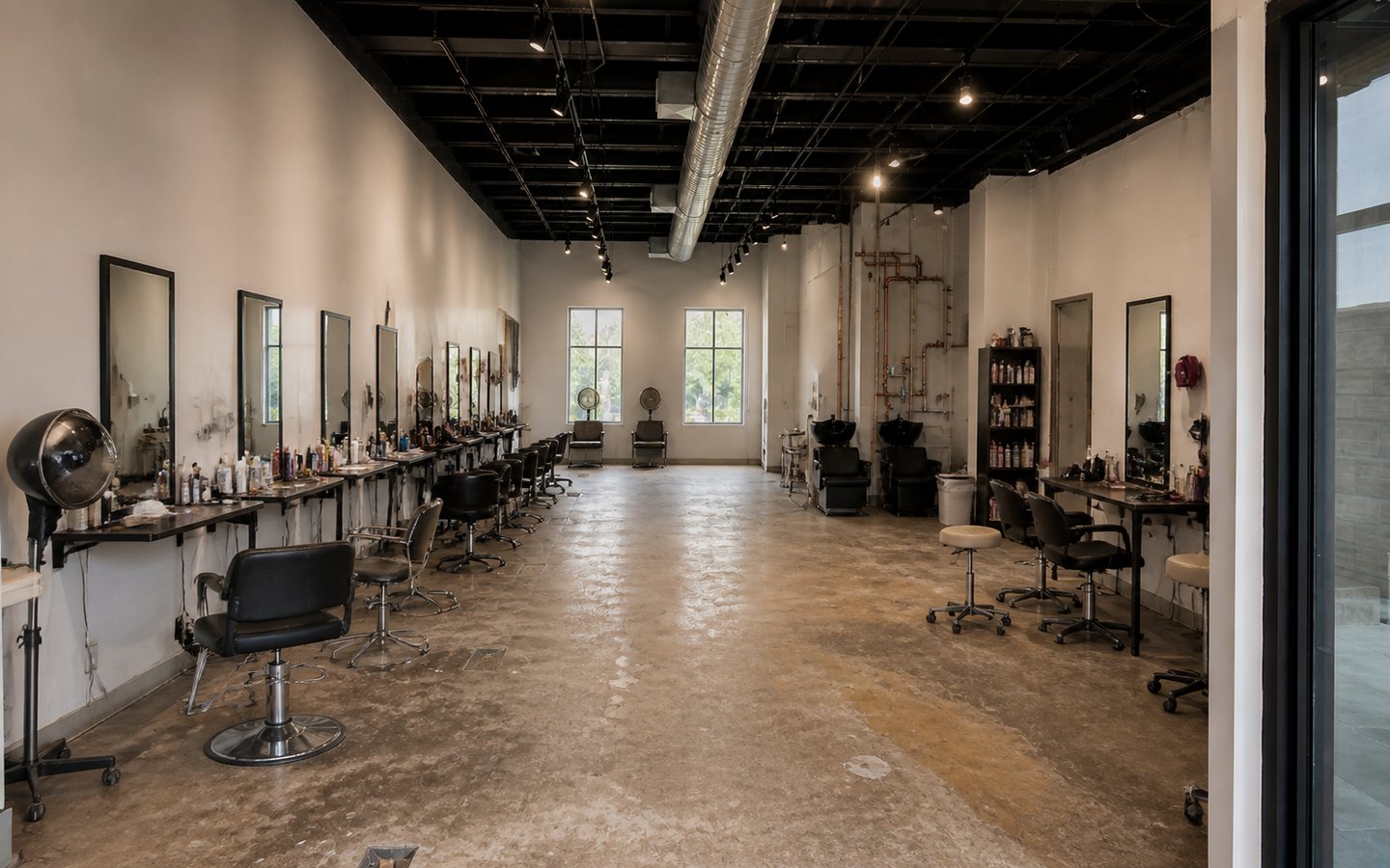 Salon and Spa Remodeling before planning visualization of the same space: A dated salon reveals station spacing, mirror, lighting, wash-area, storage, plumbing, and guest-flow constraints.